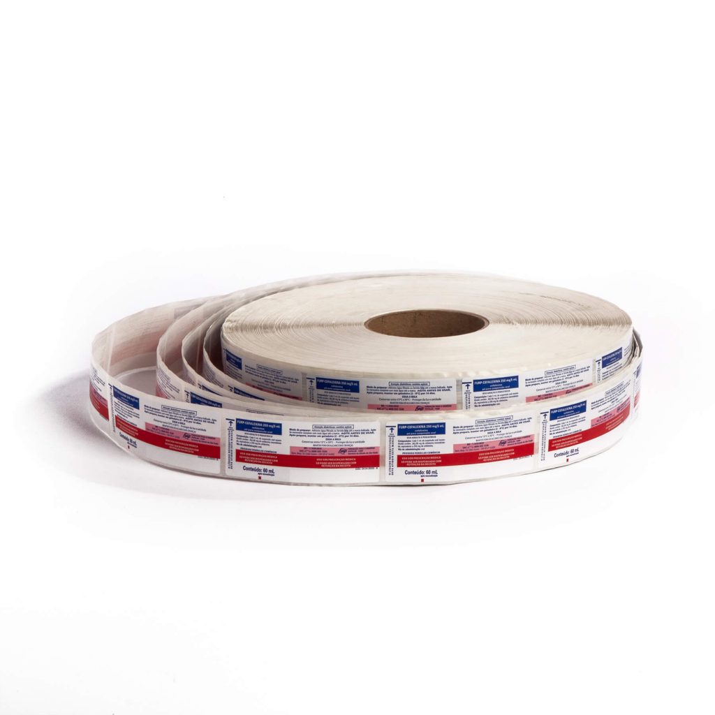 Large roll of printed labels with blue and red text on a white background.