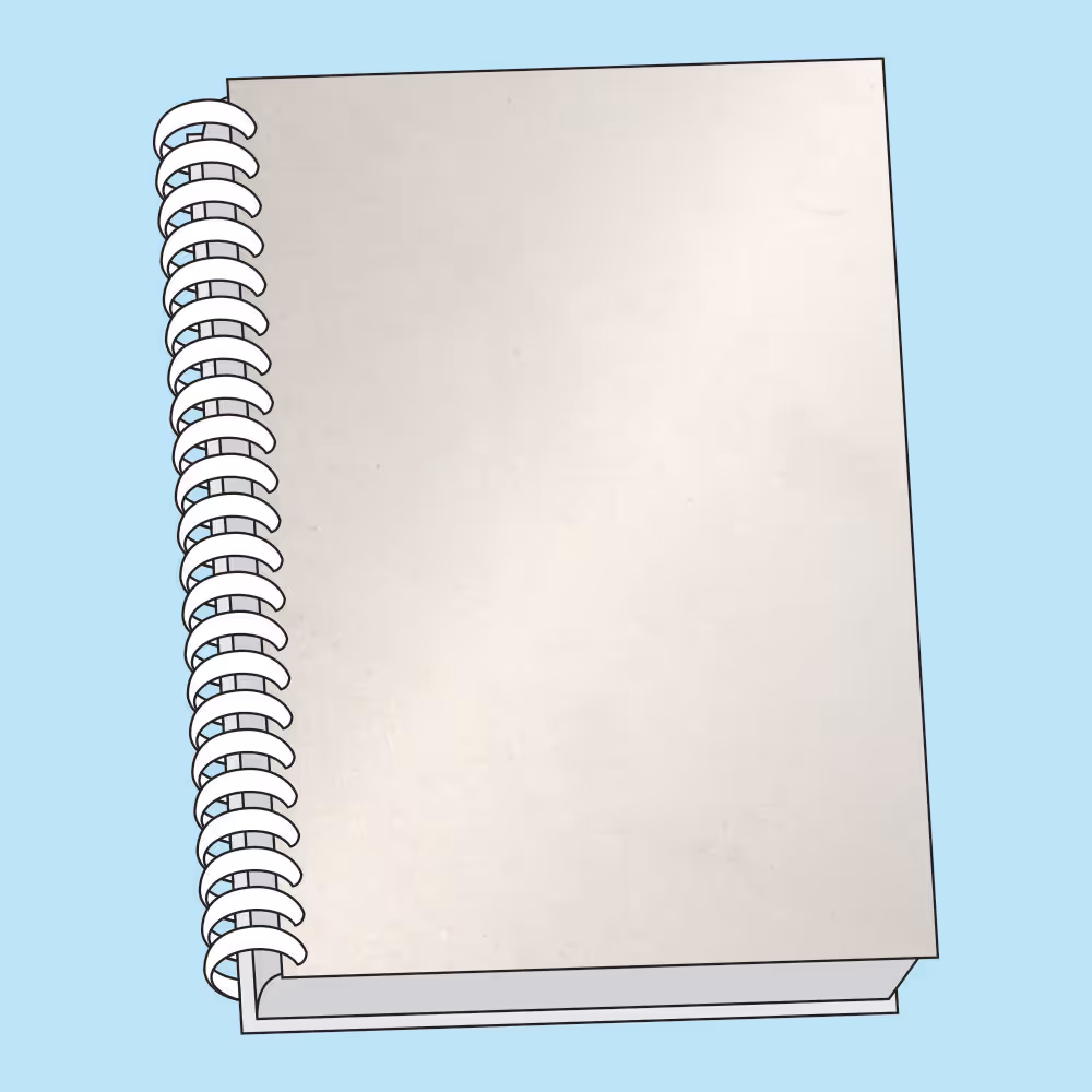 Blank spiral-bound notebook with a beige cover on a light blue background.