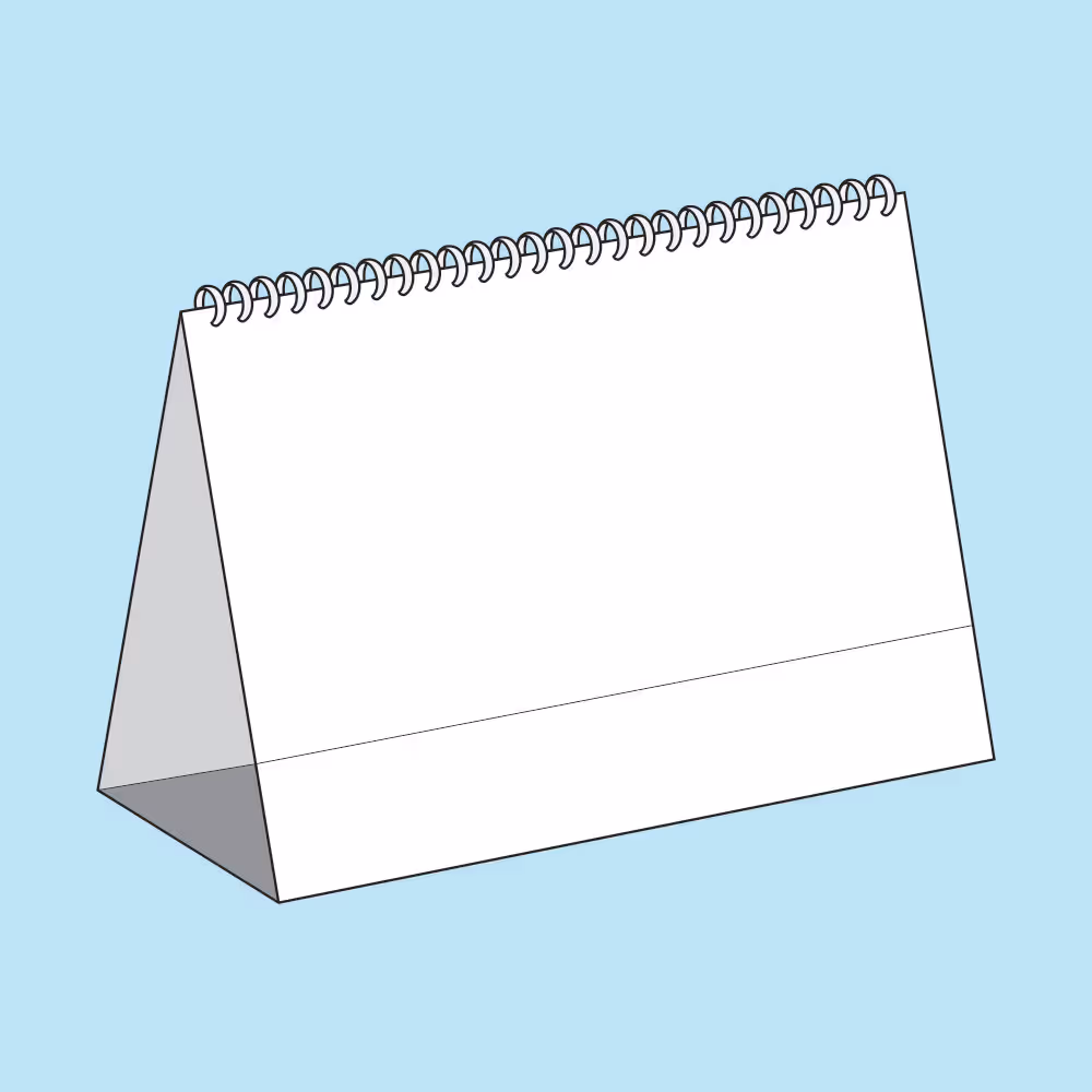 White blank wire-bound desk calendar standing on a blue background.
