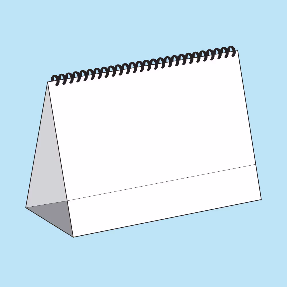 Blank white wire-bound desk calendar with a triangular stand on a light blue background.